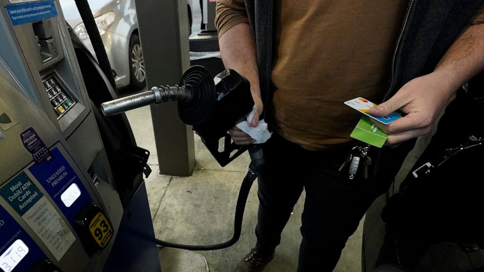 A customer prepares to pump gasoline into his car at a Sam's Club fuel island in Gulfport, Miss., Feb. 19, 2022. For the 12 months ending in March, consumer prices surged 8.5% — posting the fastest year-over-year pace since December 1981 and topping 
