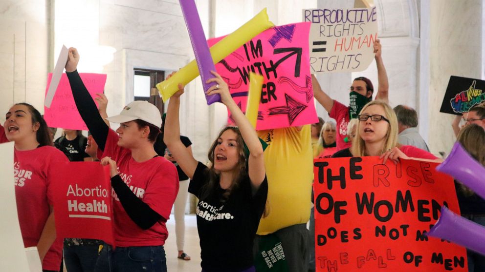 Protestors rally outside the Senate chamber at the West Virginia state Capitol in Charleston, W.Va., as lawmakers debated a sweeping bill to ban abortion in the state with few exceptions on Tuesday, Sept. 13, 2022. Several Republican lawmakers have s
