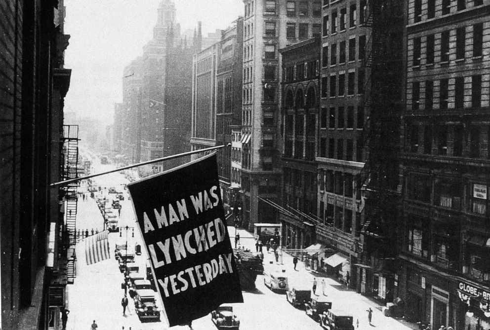 PHOTO: A flag hanging outside the headquarters of the NAACP bears the words 'A Man was Lynched Yesterday', circa 1938.