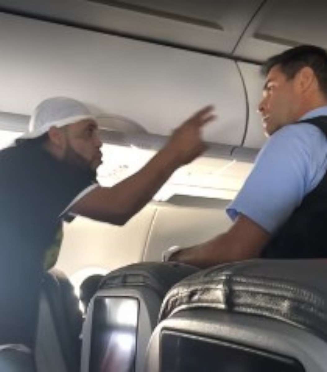 A passenger was dragged off a plane by police in Miami on Wednesday, May 23, 2018, after getting into a fight.