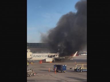 American Airlines flight catches fire at Denver airport