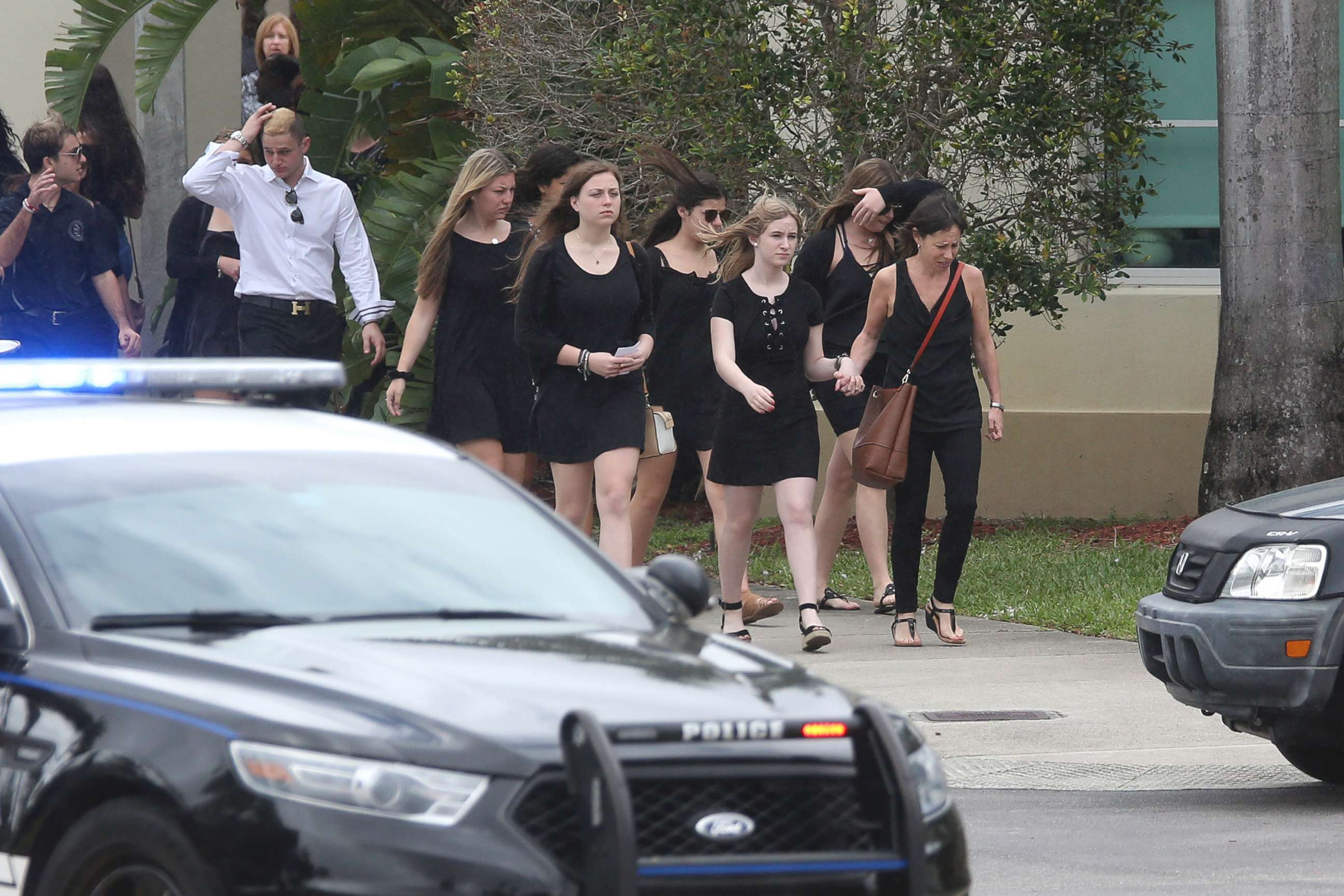 PHOTO: Mourners depart the Church by the Glades in Coral Springs, Fla., after the funeral for football coach Aaron Feis, who was killed in the mass shooting at Marjory Stoneman Douglas High School.