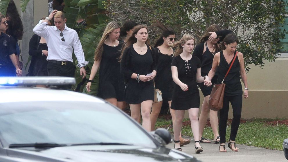PHOTO: Mourners depart the Church by the Glades in Coral Springs, Fla., after the funeral for football coach Aaron Feis, who was killed in the mass shooting at Marjory Stoneman Douglas High School.