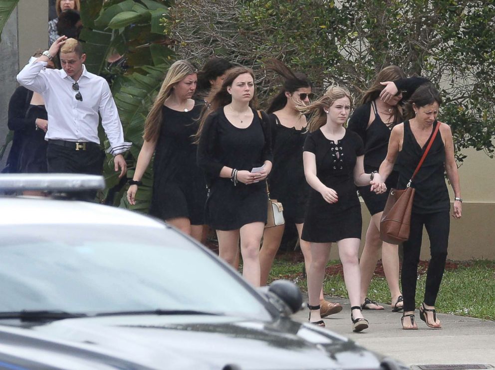 PHOTO: Mourners depart the Church by the Glades in Coral Springs, Fla., after the funeral for football coach Aaron Feis, who was killed in the mass shooting at Marjory Stoneman Douglas High School.