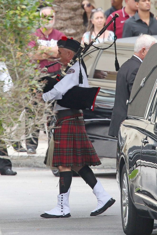 PHOTO: A bagpiper leads the casket carrying the body of Aaron Feis, who was killed at Marjory Stoneman Douglas High School, at the Church by the Glades, Feb. 22, 2018, in Coral Springs, Fla. 