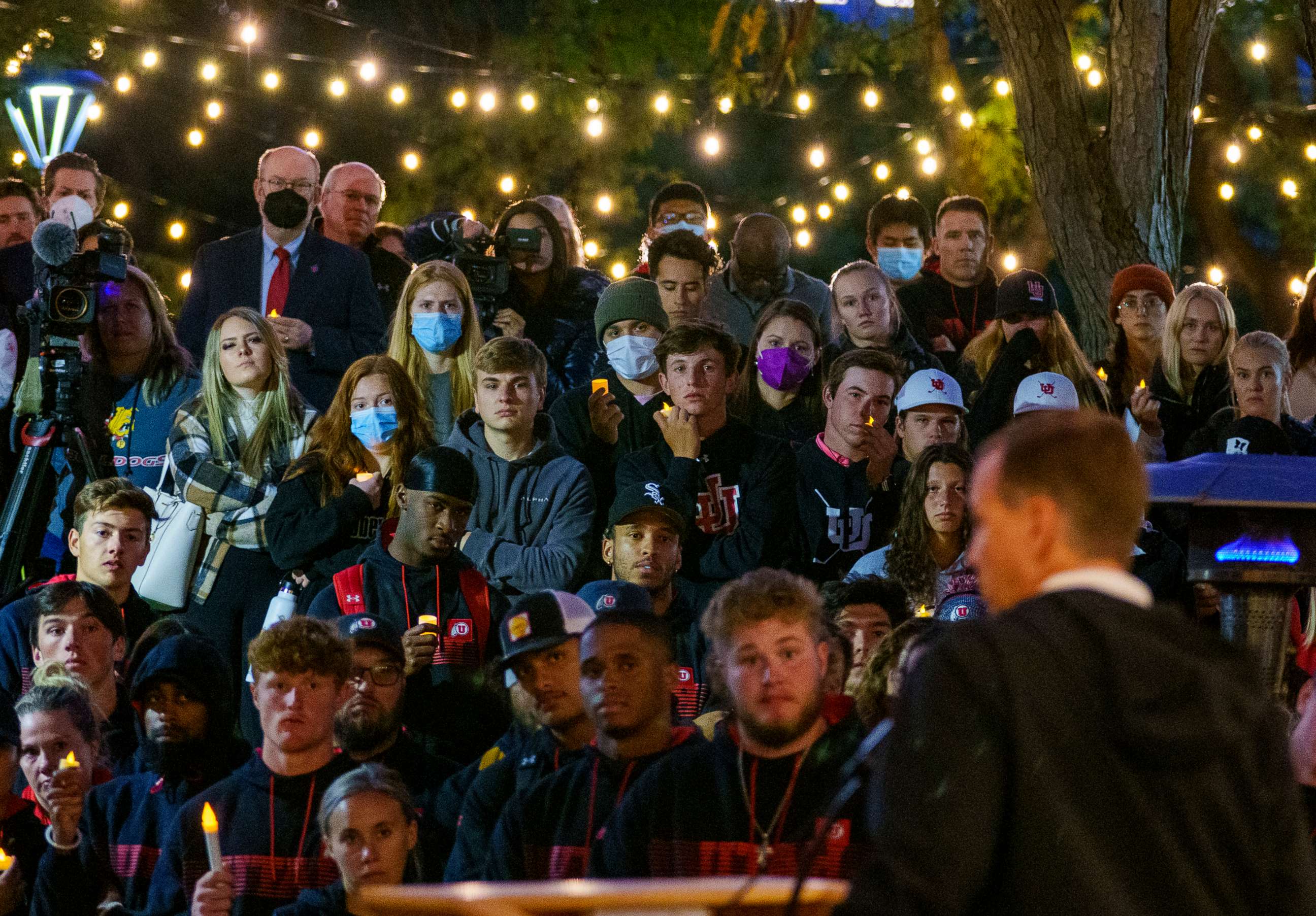 PHOTO: University of Utah athletic director Mark Harlan addresses hundreds of athletes, students, and professors who packed the student union lawn to remember Aaron Lowe during a candlelight vigil, Sept. 29, 2021, in Salt Lake City.