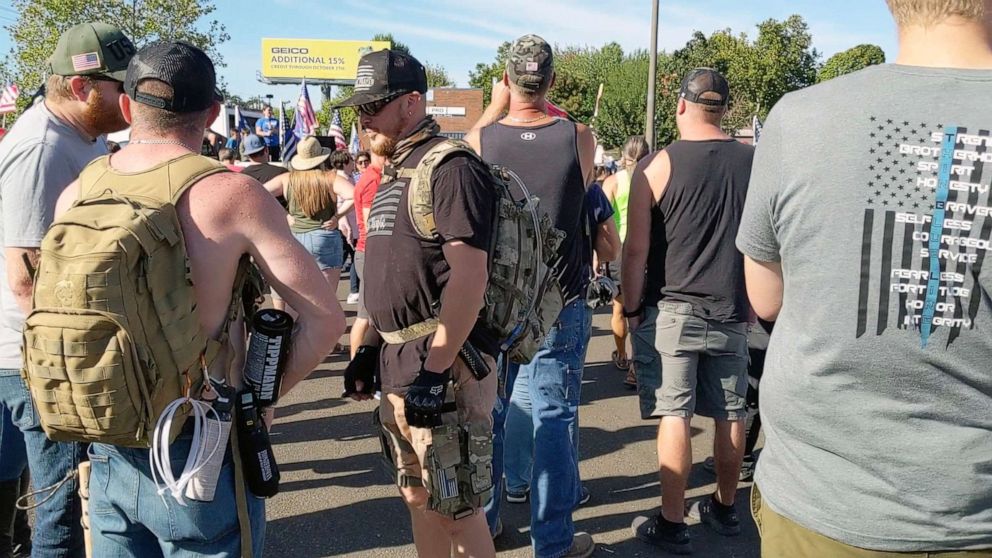 PHOTO: Aaron Danielson, center wearing a black T-shirt and a backpack, is pictured at a pro-Trump rally hours before he was killed in Portland, Ore., Aug. 29, 2020.