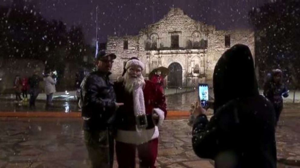 Santa Claus greeted visitors at the Alamo in San Antonio on Thursday evening as rare snow fell in the region.