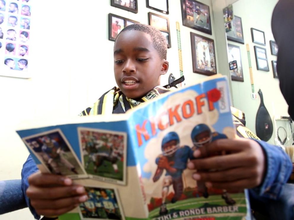 PHOTO: Children get $2 off their haircut for reading to the barbers at Fuller Cut.