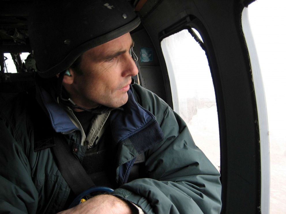 PHOTO: ABC News correspondent Bob Woodruff looks out the window of an Army helicopter on route to Taji, Iraq, Jan. 27, 2006.