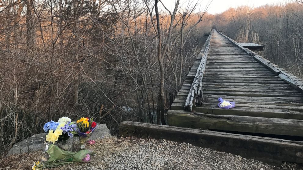 PHOTO: Flowers sit by a bridge near Delphi, Ind. where Liberty German and Abigail Williams were seen before they were reported missing by their families on Feb. 13, 2017.