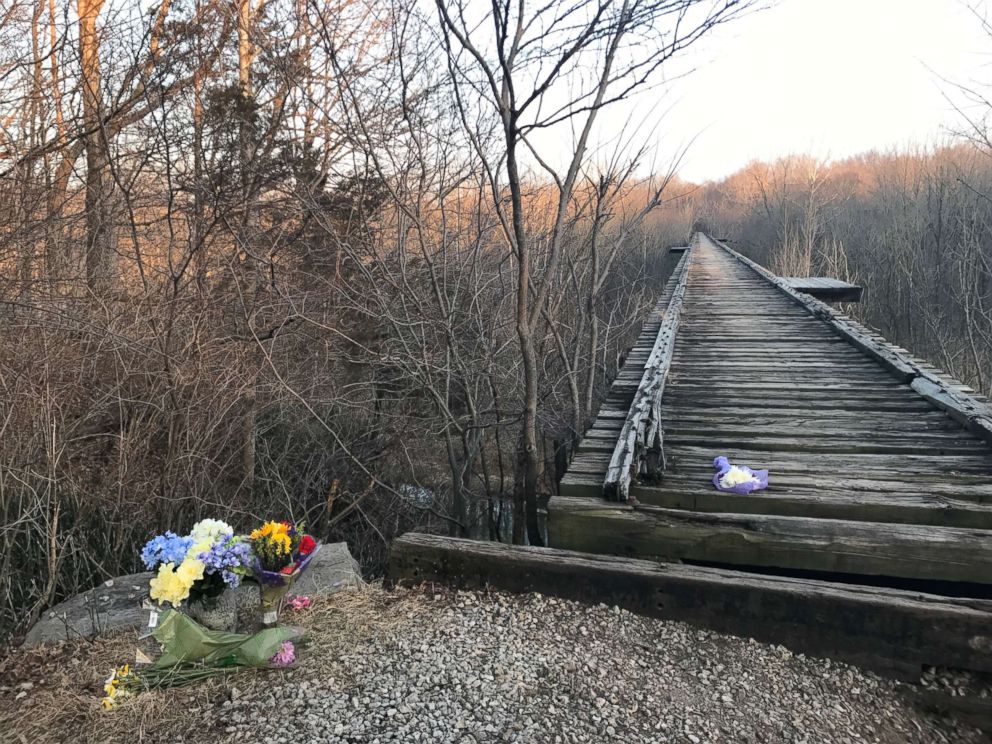PHOTO: Flowers sit by a bridge near Delphi, Ind., where Liberty German and Abigail Williams were seen before they were reported missing by their families on Feb. 13, 2017.