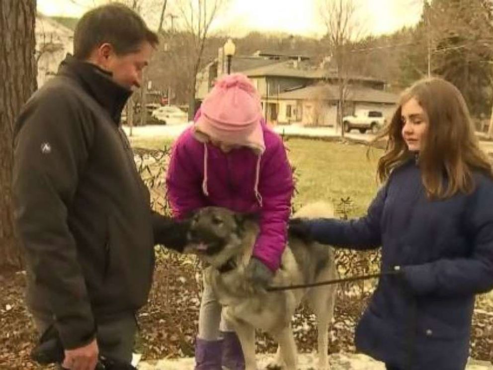 The Haddock family of Saugatuck, Mich., poses with Ryder, who was approved for unemployment benefits.