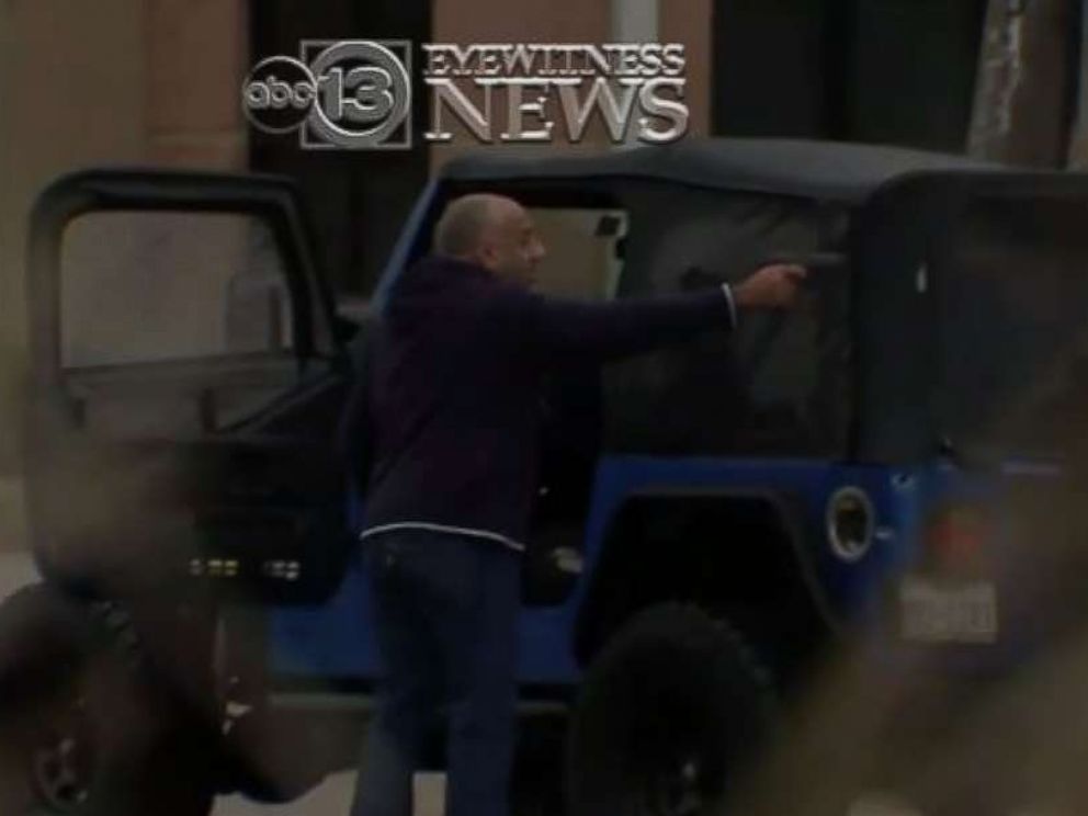 A man points a gun at another driver in a road rage incident in Houston on Dec. 6, 2017.