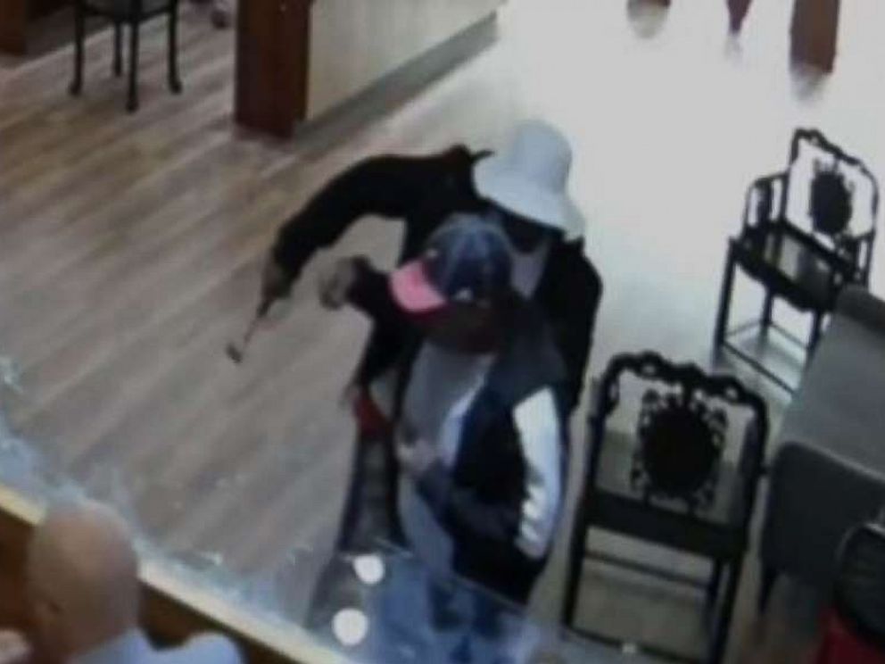 One man bashed display cases with a hammer, while the other made off with $2 million in jewelry from a Houston-area store on Jan. 10, 2018.