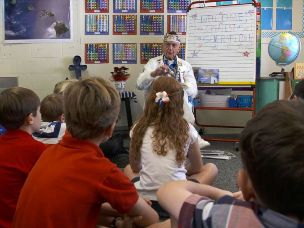 PHOTO: Pearl Harbor survivor Stuart Hedley speaks to students at the Navy Hale Keiki School in Honolulu. Hedley was a 20-year-old seaman, first class, assigned to the third division when the Japanese attacked on Dec. 7, 1941.
