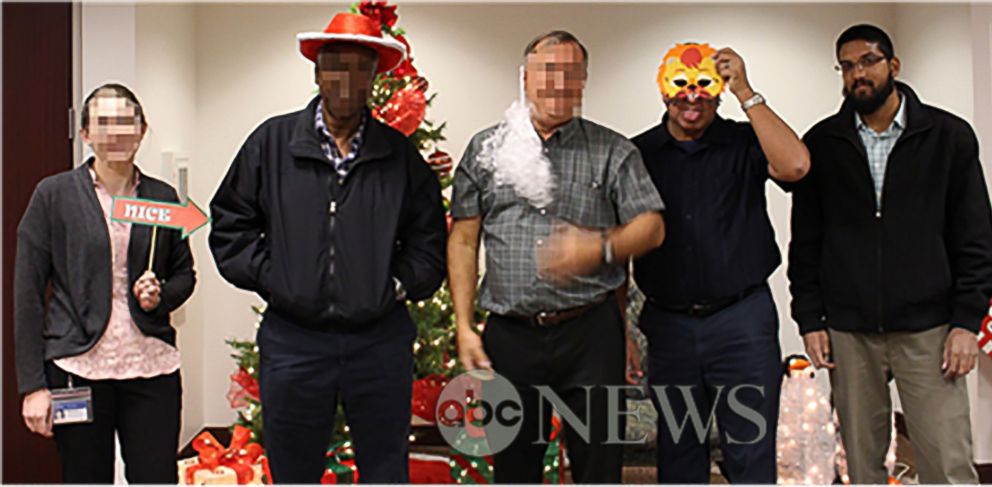 PHOTO: In a photo obtained by ABC News, Syed Farook is seen posing with his coworkers in front of a Christmas tree inside the Inland Regional Center shortly before launching into a rampage that left 14 people dead on December 2, 2015.