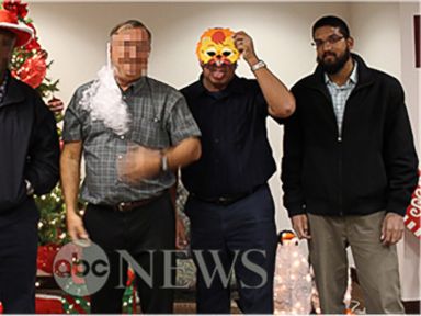 PHOTO: In a photo obtained by ABC News, Syed Farook is seen posing with his coworkers in front of a Christmas tree inside the Inland Regional Center shortly before launching into a rampage that left 14 people dead on December 2, 2015.