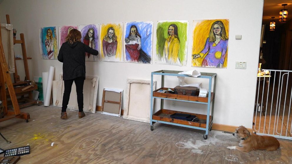 Maria Farmer is seen here working on seven portraits for her series, "The Survivors Project."