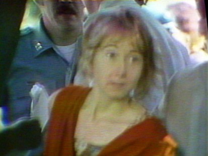 VIDEO: Squeaky Fromme tries to assassinate President Ford in 1975.