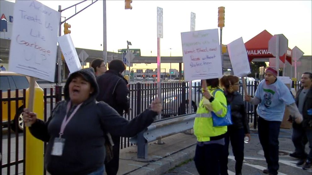 PHOTO: Air Serv cabin cleaners picketed outside New York's LaGuardia Airport, Oct. 9, 2014, striking over health and safety issues, including fears of possible exposure to Ebola.