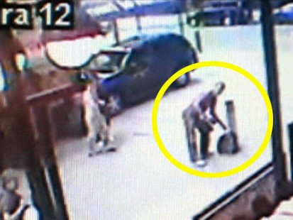 VIDEO: Police examine security footage of a man removing his shirt in Times Square.