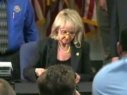 Video: Gov Brewer signs controversial bill.