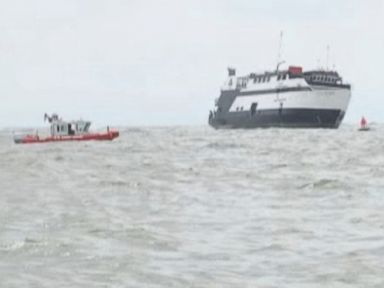 U.S. Coast Guard says the Escapade carrying 123 people got stuck on rocks during low tide.