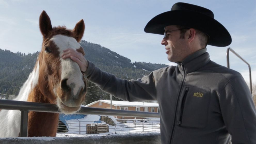 PHOTO: Tim Kellogg, a cowboy and a chocolatier, pets a horse on a ranch in Jackson, Wyo., Feb. 5, 2016.