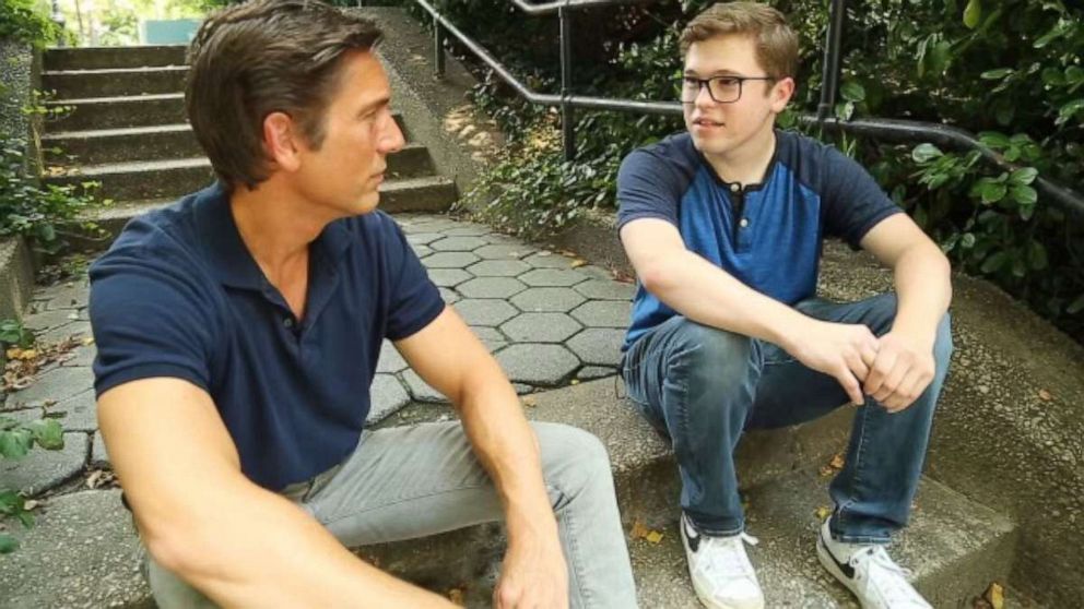 David Muir is seen here talking with Jake Campbell, whose mother was killed in the south tower on Sept. 11, 2001.