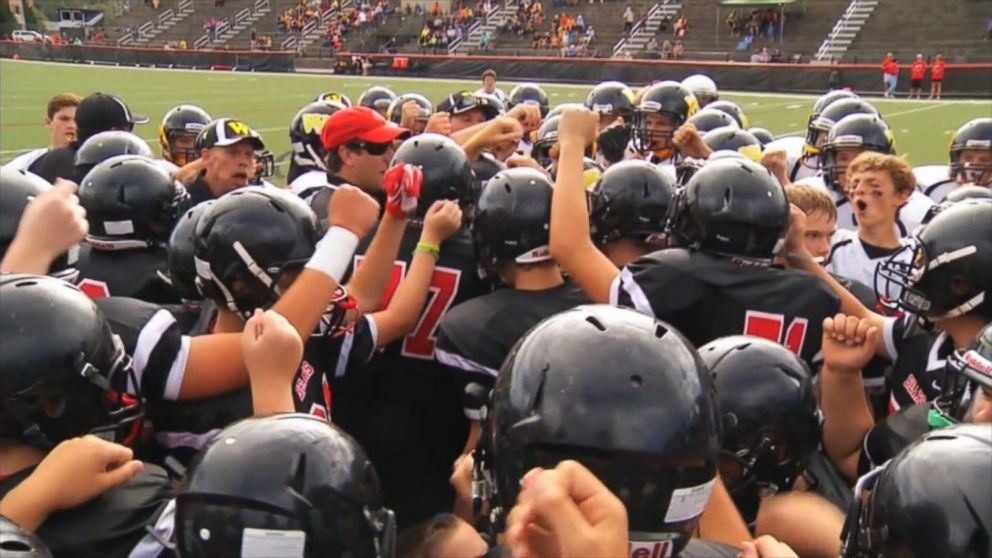 PHOTO: Lou Stamey's teammates rallied around him after he score a 50-yard touchdown in last week's game. 