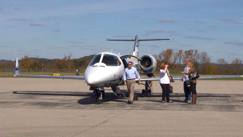 PHOTO: Attorney Michael Fuller, left, and colleagues arrive in West Virginia on Fuller's private plane.