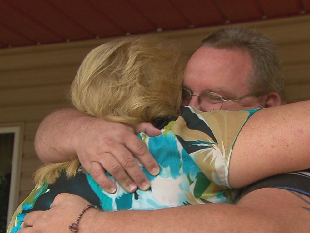 Kriste Hughes (left) is seen here meeting her brother Roger Tipton (right) for the first time.