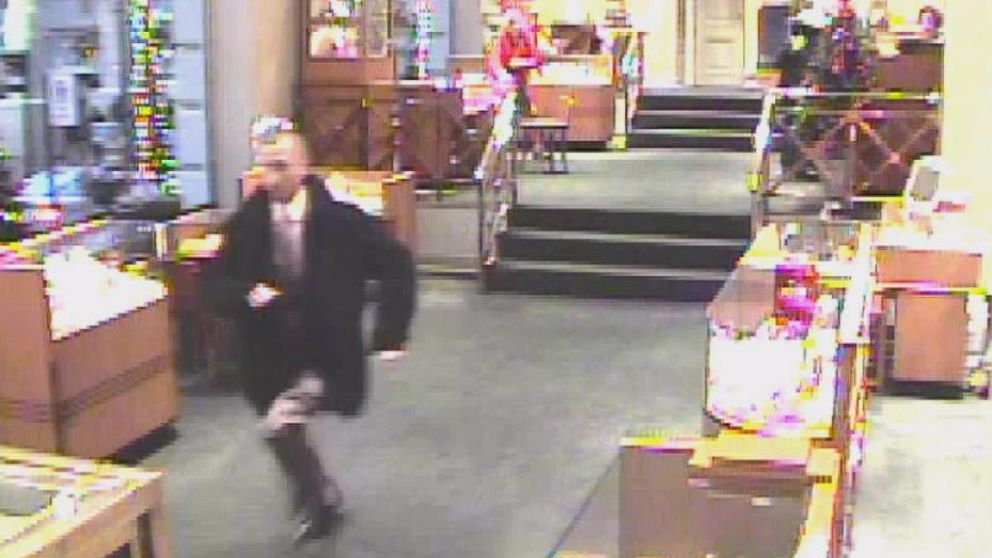 Victor Lupis is seen here on surveillance video running out of the David Marguilis' jewelry store in Portland, Oregon in December 2010.
