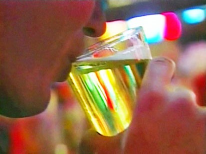 Picture of person drinking beer.