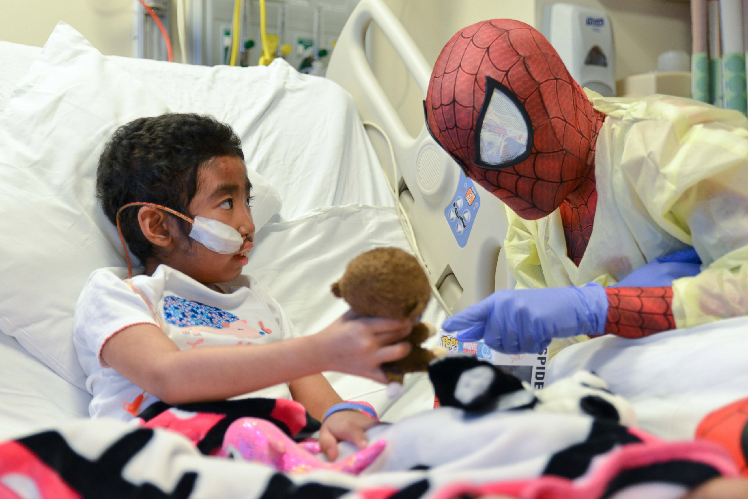 PHOTO: Christina, 8, shows Spiderman her favorite stuffed monkey, Coconut and later her stuffed panda, Bamboo.