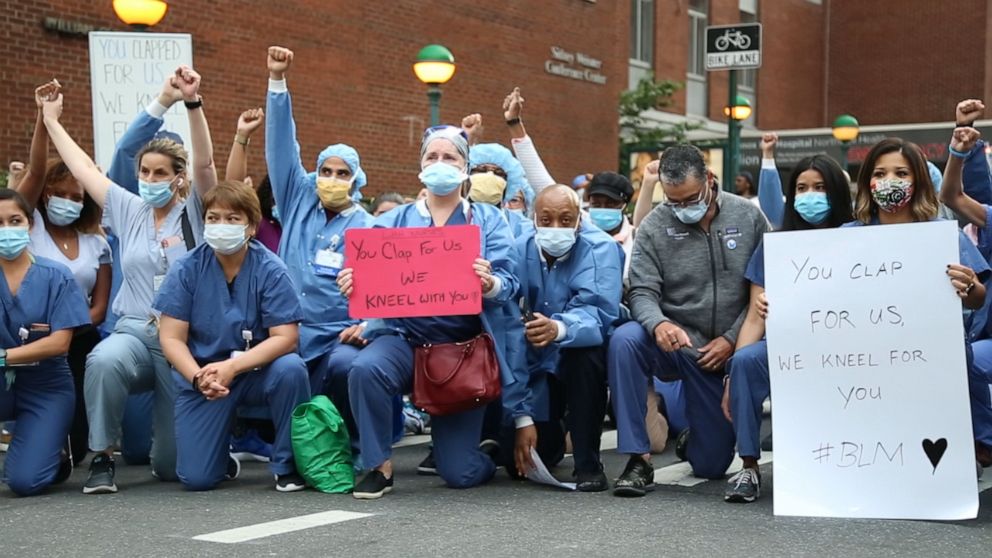 VIDEO: Frontline health care workers kneel in solidarity