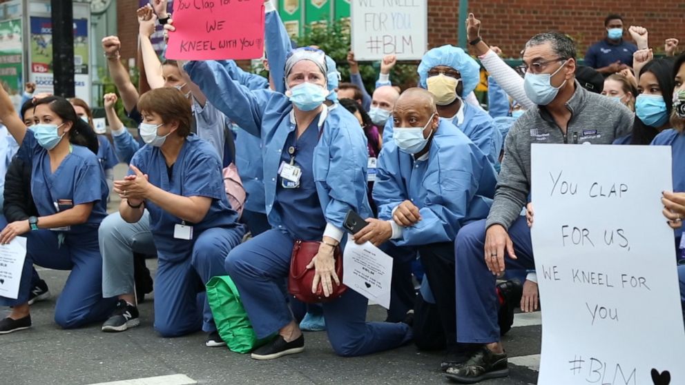 Lenox Hill Hospital workers took a knee during the 7 p.m. city-wide cheer for essential workers on June 2, 2020.