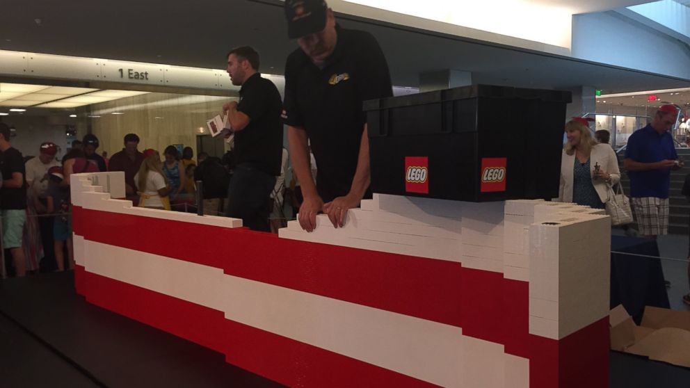 PHOTO: More than 15,000 museum visitors helped father-son LEGO master builder team Dan and Chris Steininger create the 9.5-by-14-foot flag. 