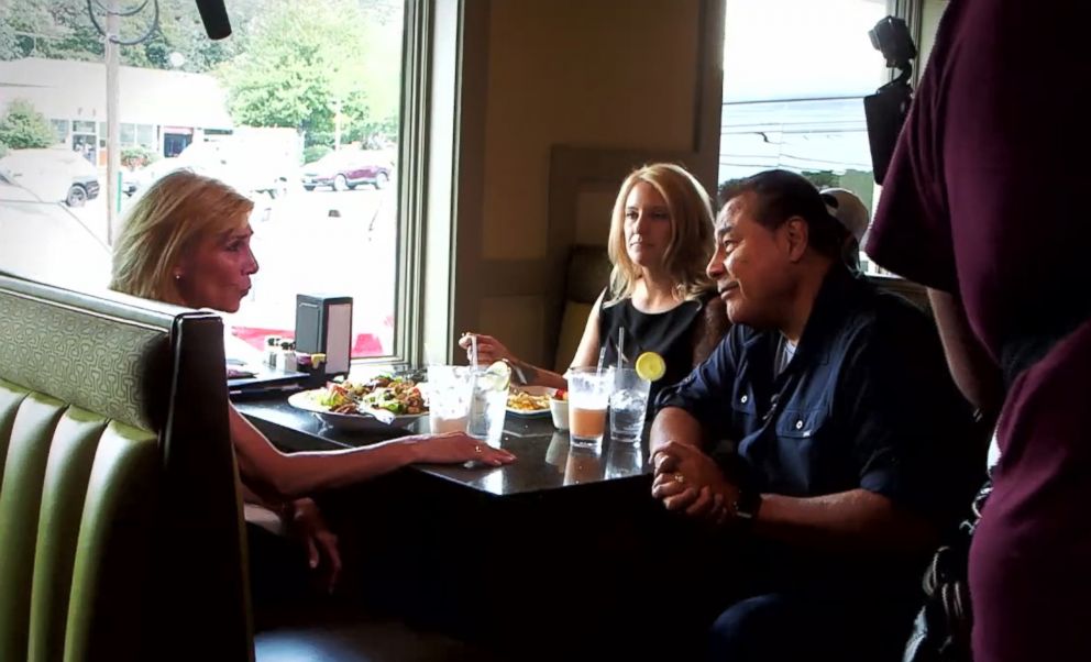 Customers being interviewed by "What Would You Do?" host John Quinones. 