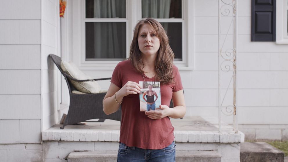 PHOTO: Michelle Licata holds a photo of her younger self.