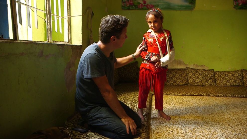 ABC News' Ian Pannell talks with 6-year-old Malak in Mosul during a report for "Nightline."