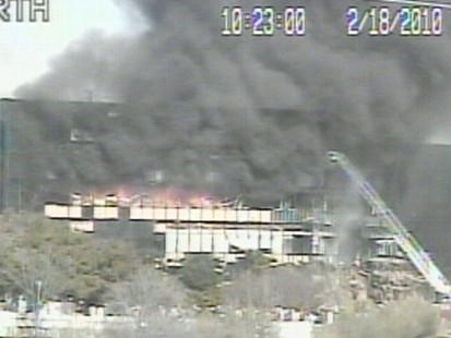 VIDEO: Firefighters put out a blaze caused by a plane crashing into a Texas building.
