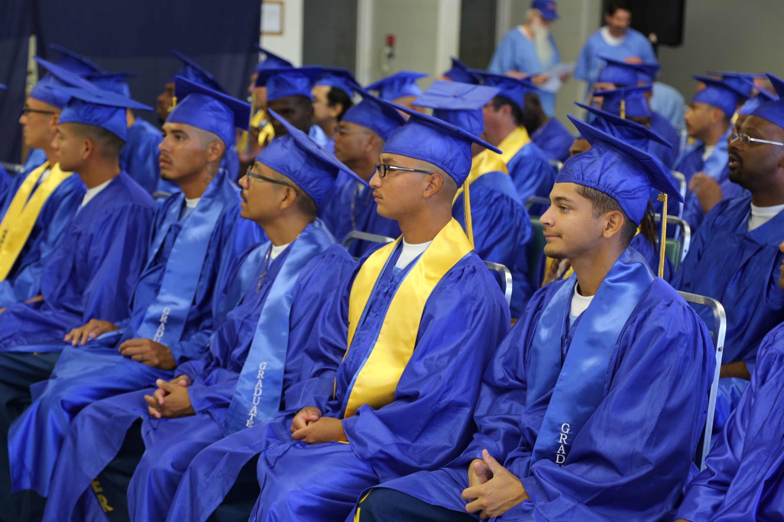 These prison inmates are receiving their college diplomas at the Ironwood State Prison/Palo Verde College 2015 Commencement Ceremony.