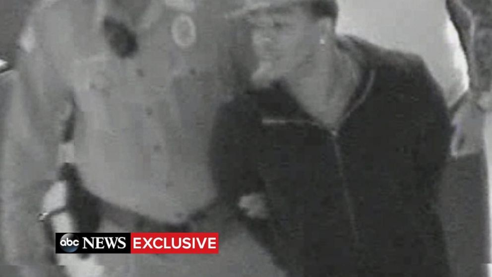 PHOTO: Video shows Ray Rice in handcuffs after he punched his wife in an Atlantic City elevator.