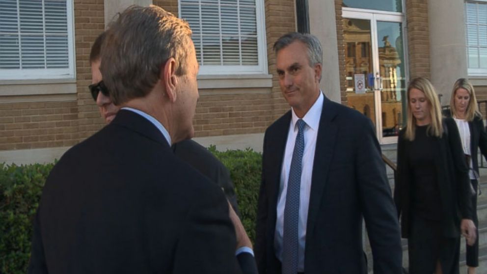 ABC News' Brian Ross poses questions to Trinity Highway Products President Gregg Mitchell outside a Texas courthouse Oct. 15, 2014.