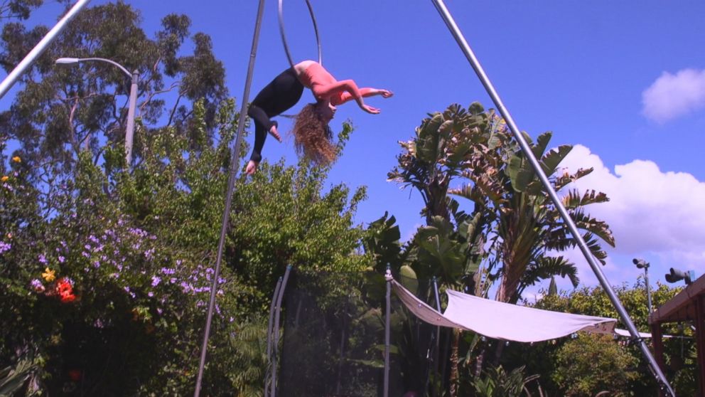 Sofie Dossi, 16, is seen here practicing in the backyard of her familys California home.