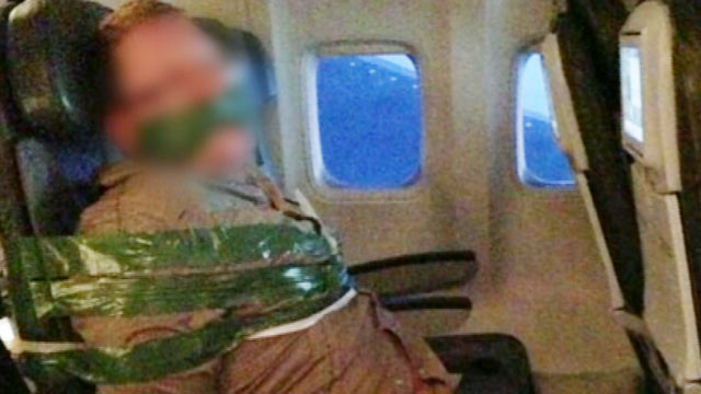 passenger duct taped to seat