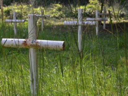 VIDEO: A team of anthropologists dig up childrens bodies at Boot Hill Cemetery.