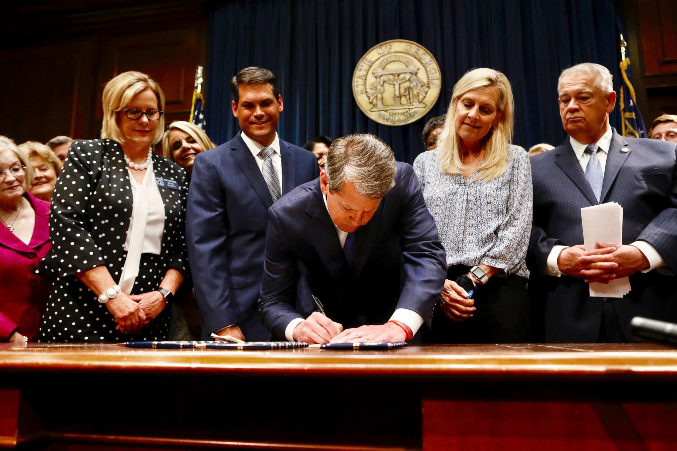 PHOTO: Georgia Gov. Brian Kemp signs legislation banning abortions once a fetal heartbeat can be detected, in Atlanta, May 7, 2019.